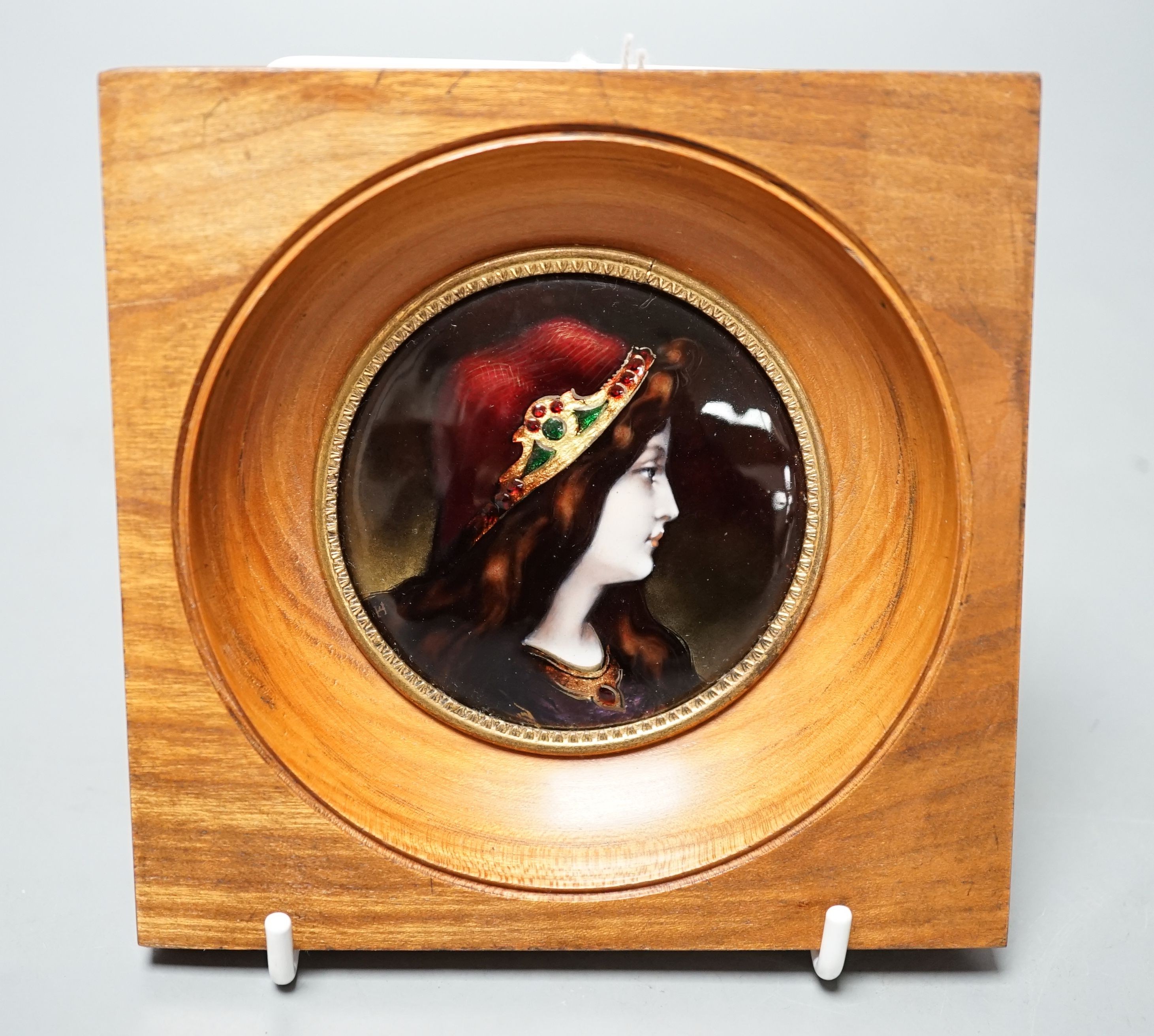 A framed Limoges enamel portrait miniature, 7.5cm diameter